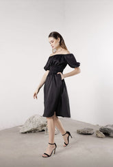 Silk off-shoulder midi dress with ruched bodice and puff sleeves for a feminine silhouette